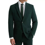 Front angled view of a royal green three-piece men's suit with peak lapel and premium suiting fabric.