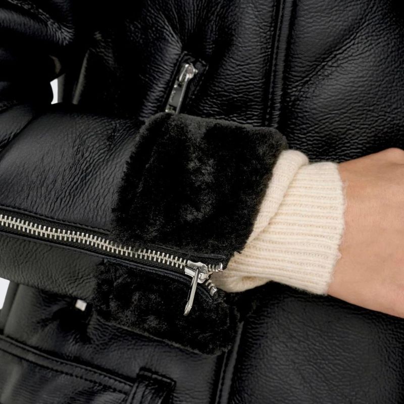 Women’s black leather jacket with shearling zipper cuffs