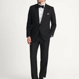 Black tuxedo jacket styled with white shirt and bow tie