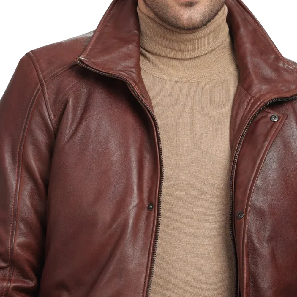 Zip and snap placket on brown leather car coat