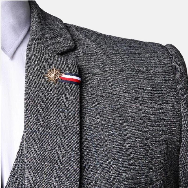 grey-three-piece-Close-up of grey tweed suit notch lapel, shoulder and decorative lapel pinsuit-for-mens