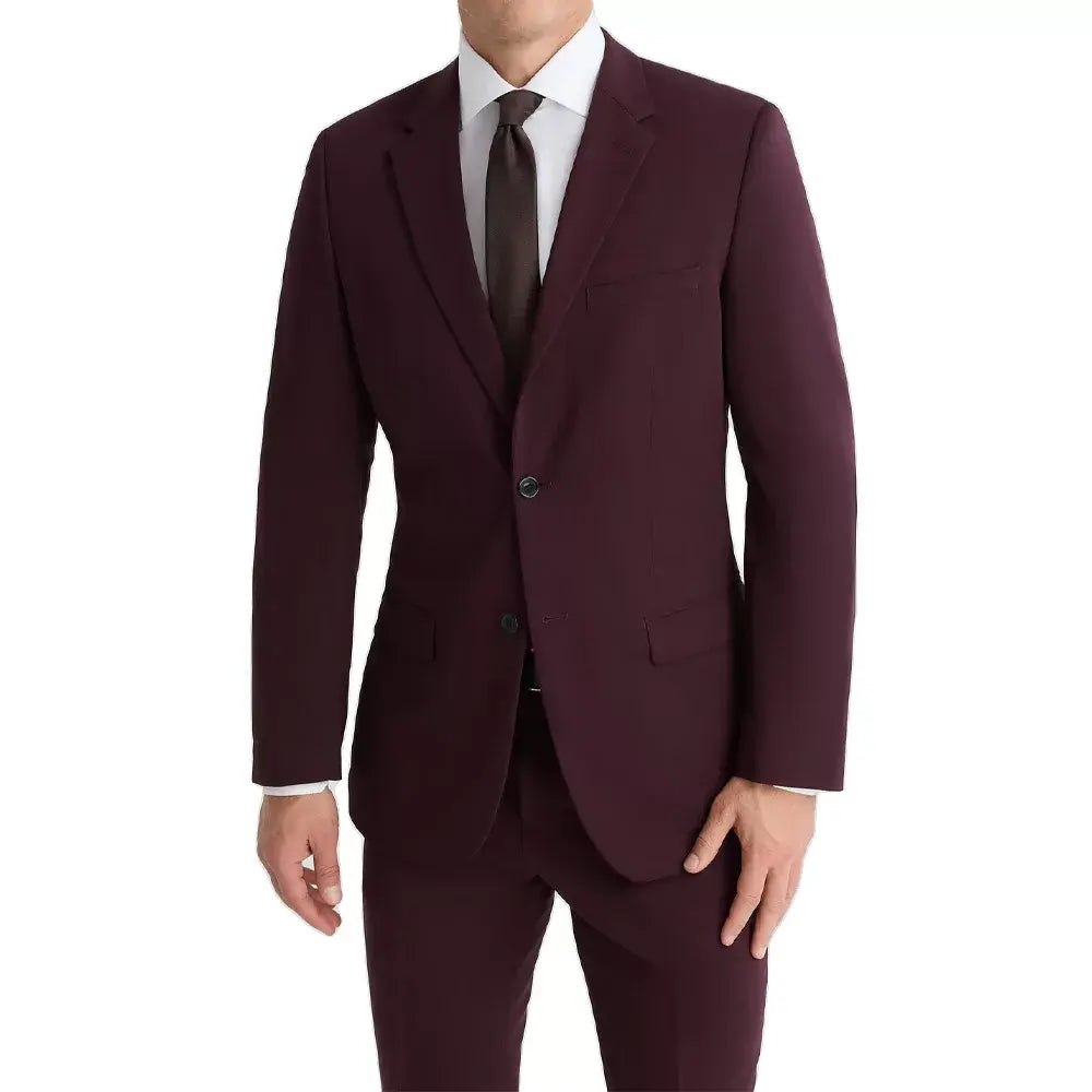 Front angled view of a slim fit maroon men's suit with elegant peak lapels and premium suiting fabric.