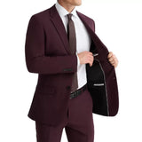 Close-up of the maroon peak lapel suit highlighting the sharp lapels, button closure, and premium craftsmanship.