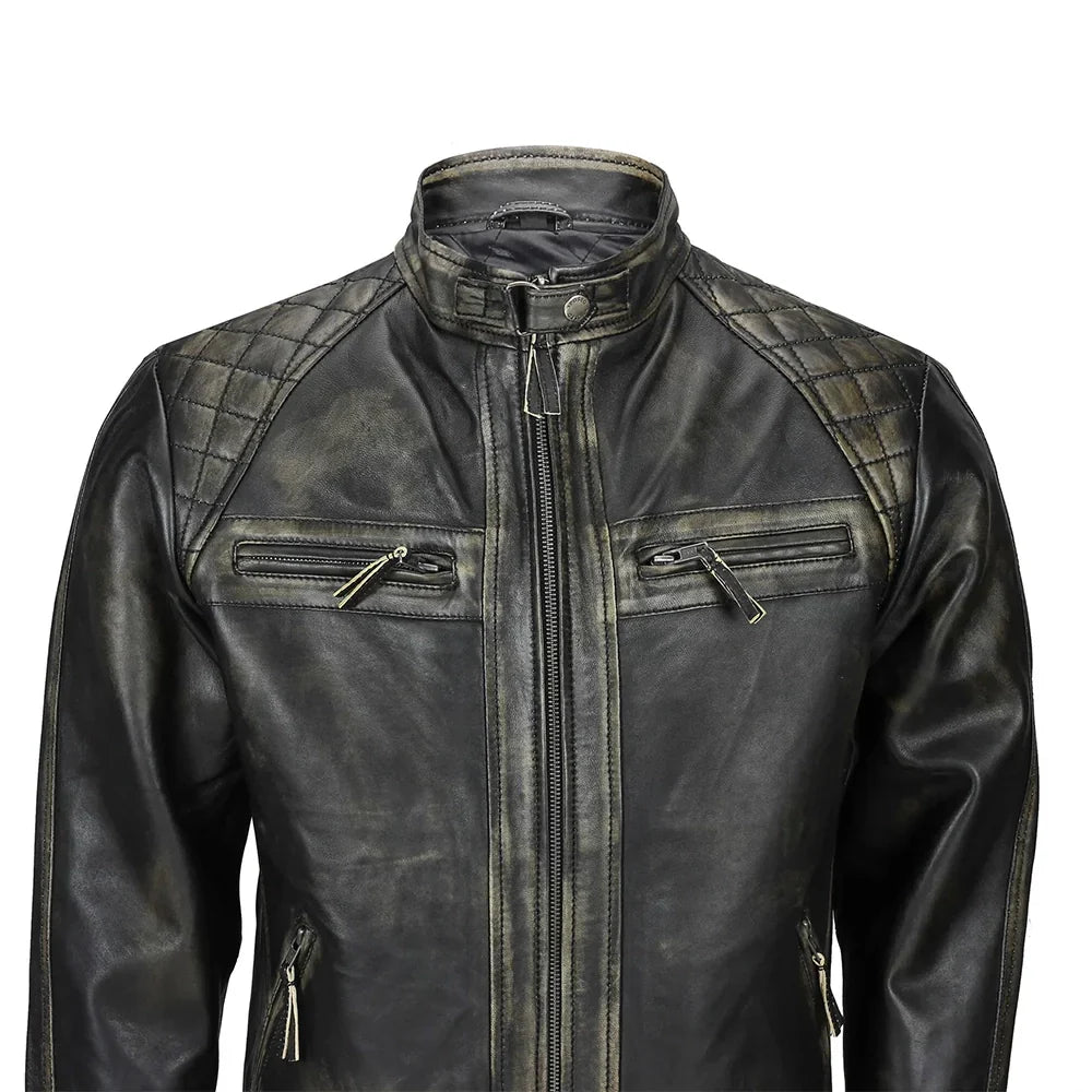 Close-up of men’s distressed black leather biker jacket with snap collar and antique gold zippers
