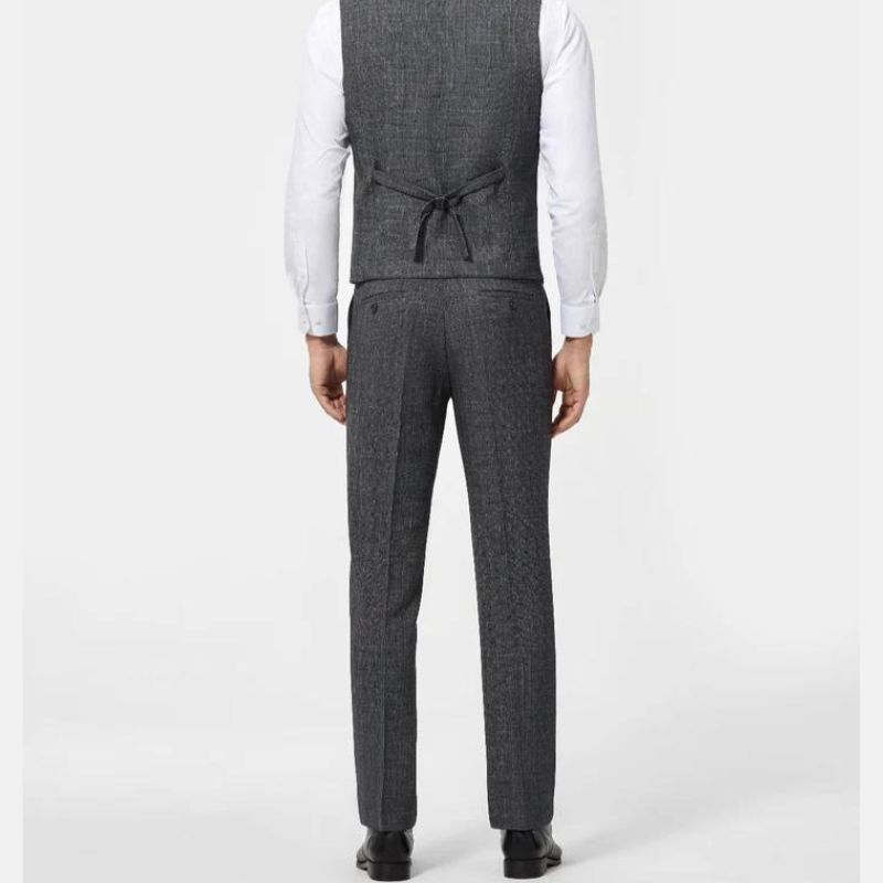 Back view of men’s grey suit vest and matching straight-cut trousers