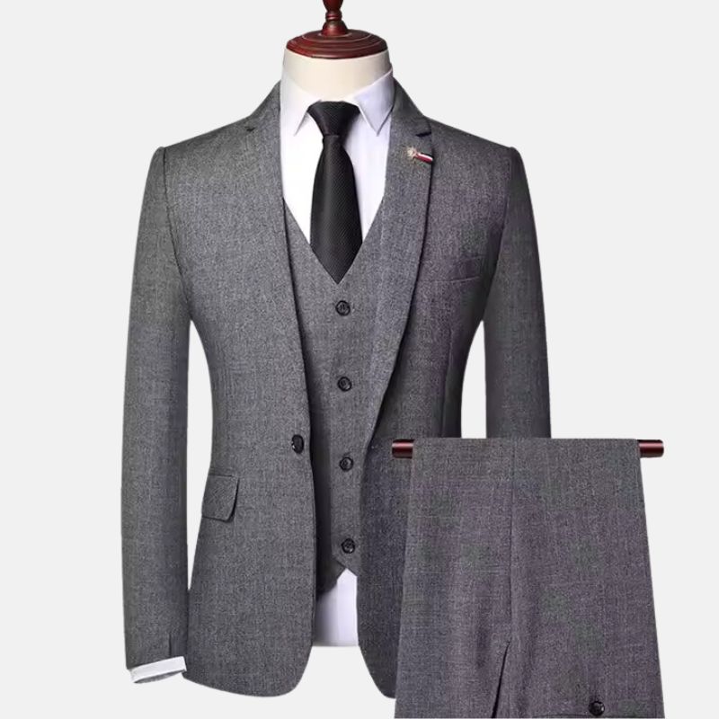 Men’s grey herringbone three-piece suit with jacket, vest and matching trousers