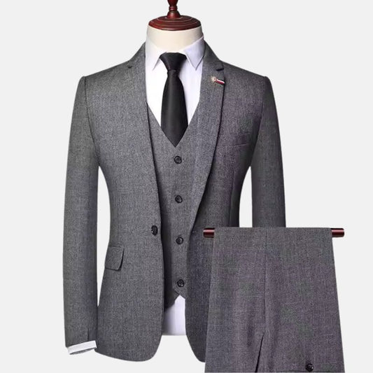 Men’s grey herringbone three-piece suit with jacket, vest and matching trousers
