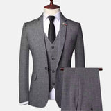Men’s grey herringbone three-piece suit with jacket, vest and matching trousers